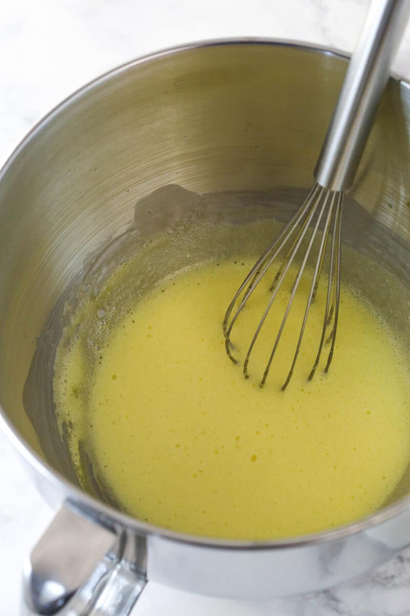 Whisking egg and sugar mixture to make chocolate mousse.