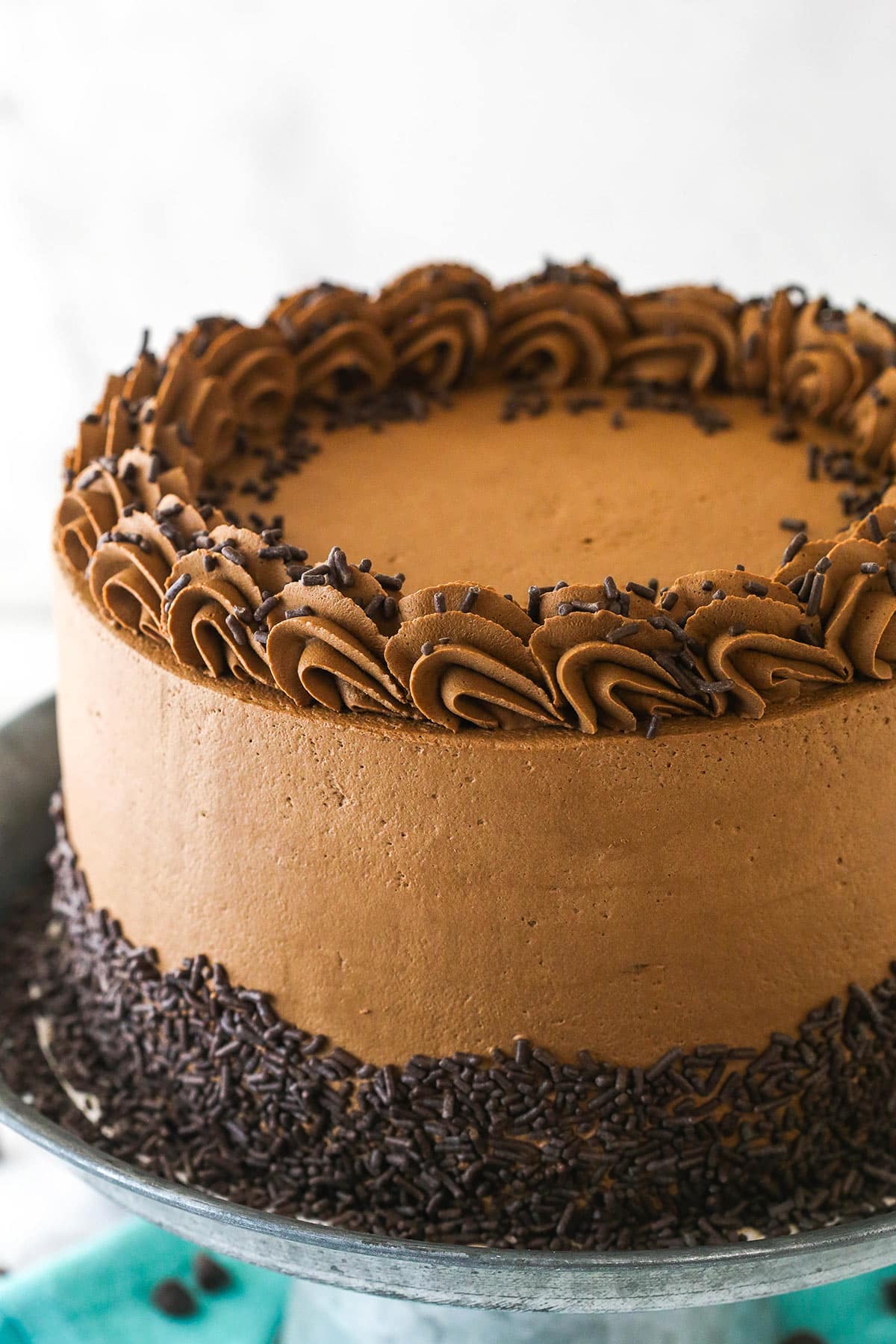 Chocolate mousse layer cake on a cake stand.