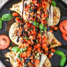 Overhead view of Bruschetta Chicken in a black pan