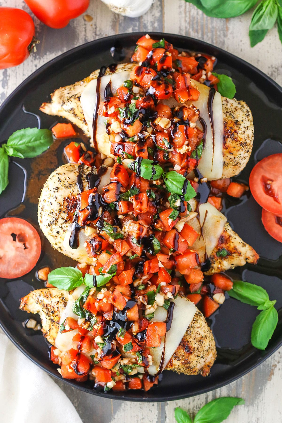 Overhead view of Bruschetta Chicken in a black pan