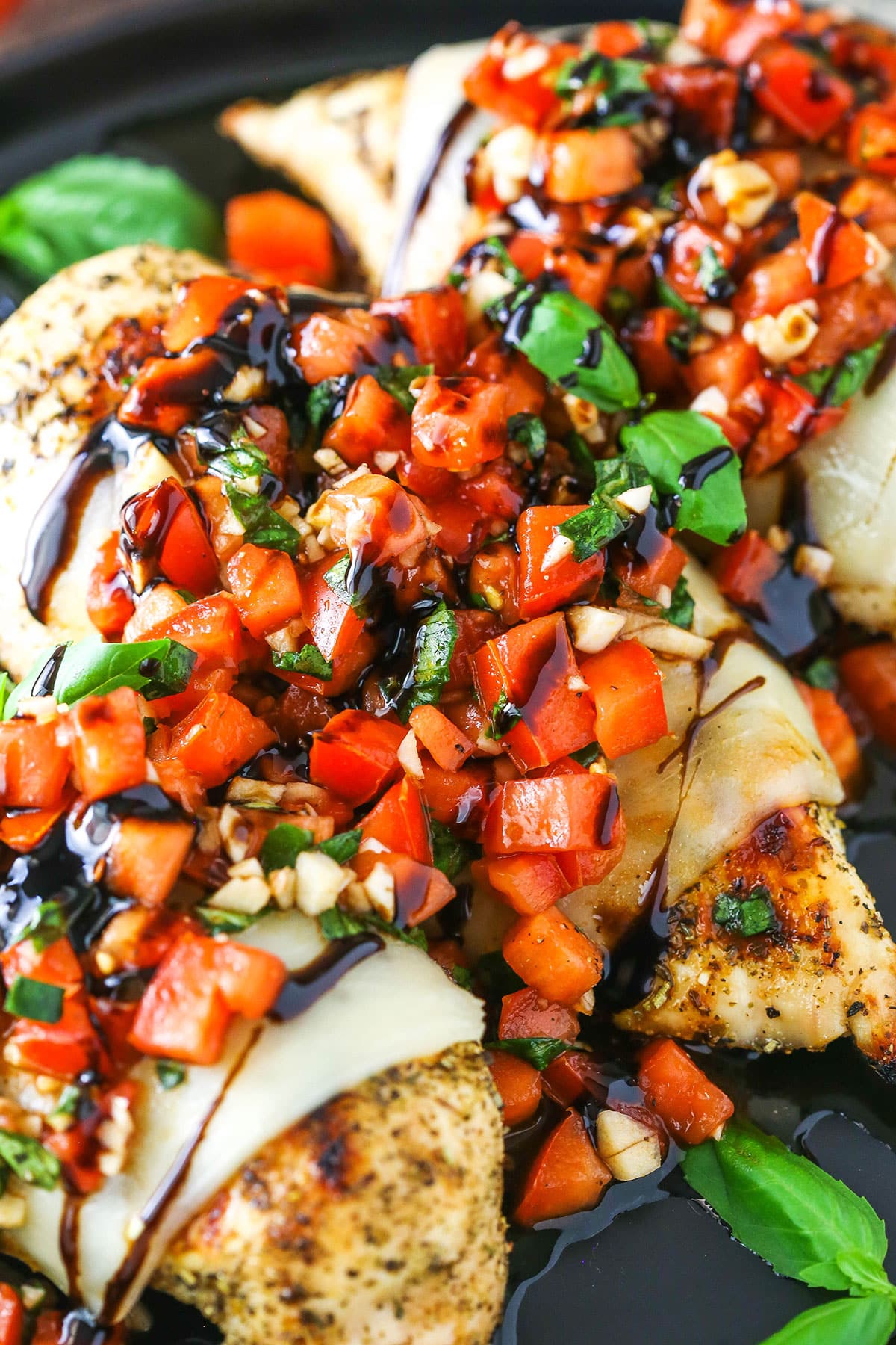 Bruschetta Chicken in a black pan