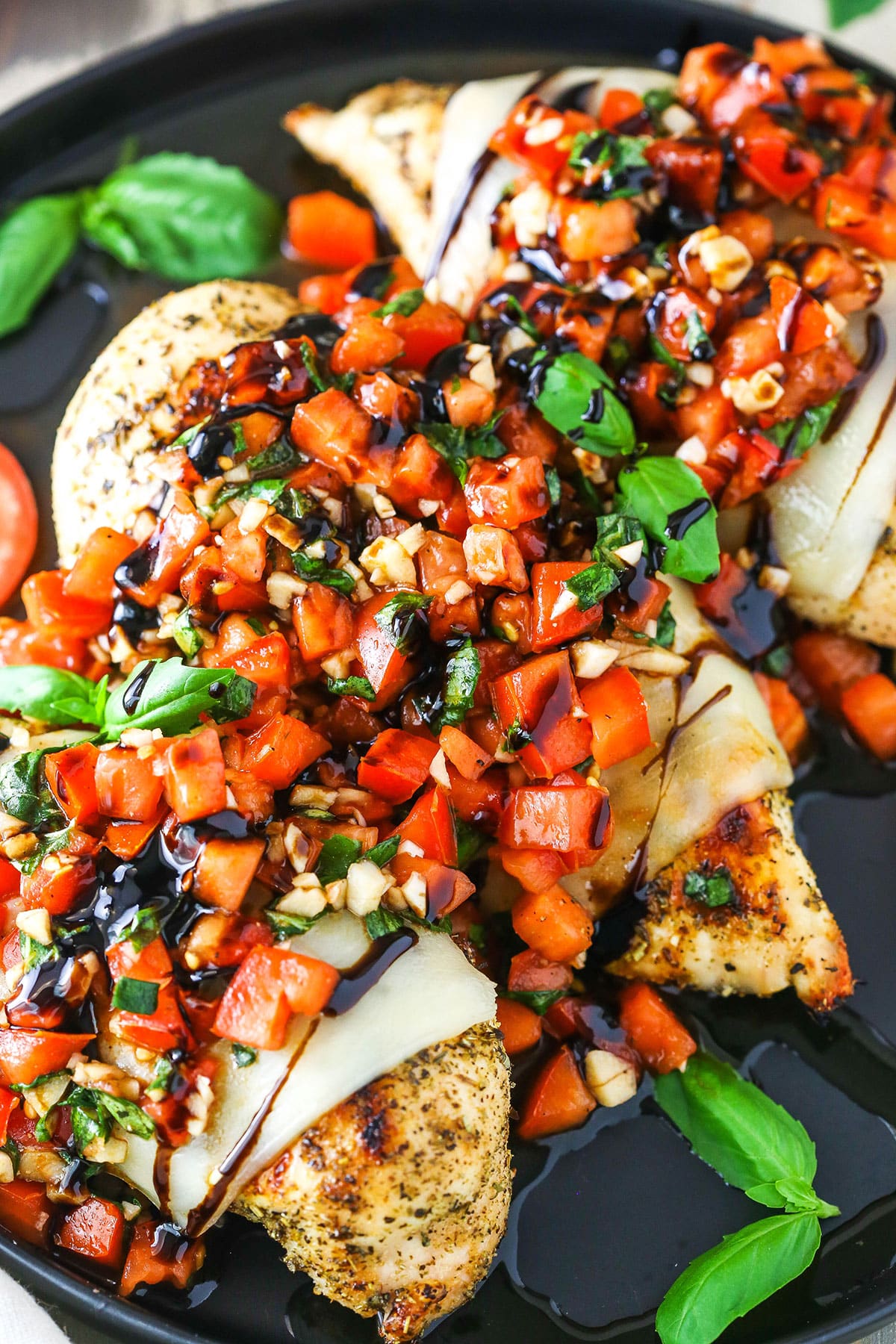 Bruschetta Chicken in a black pan