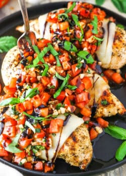 Bruschetta Chicken in a black pan