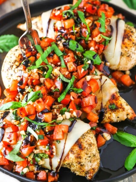 Bruschetta Chicken in a black pan