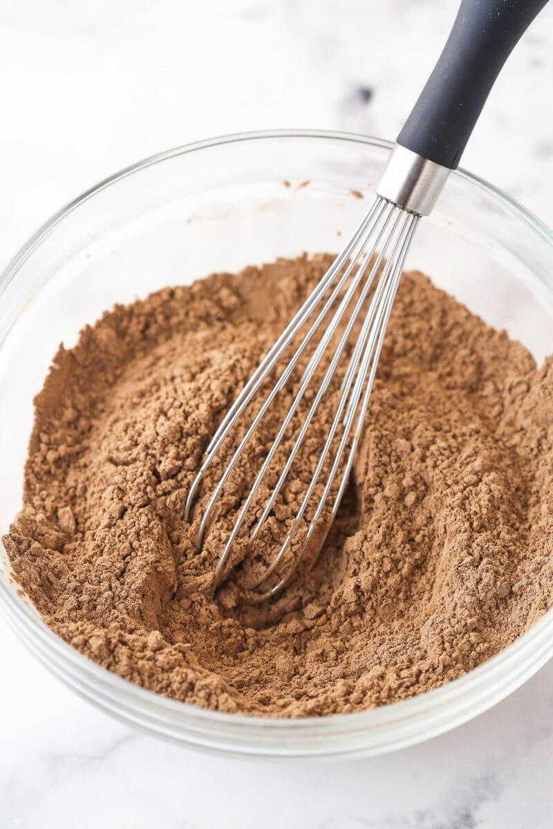 Whisking together dry ingredients for brownie batter.