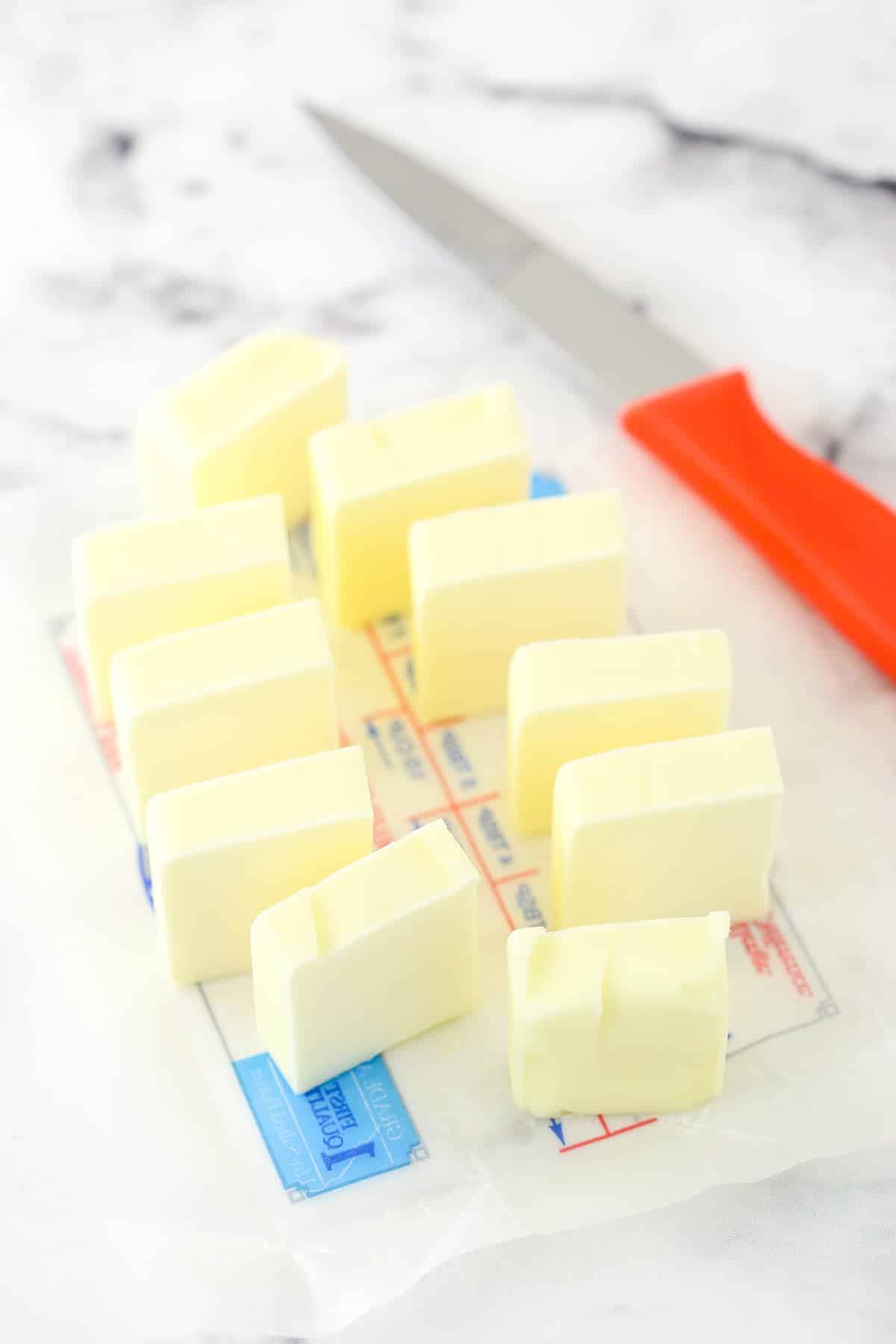 a stick of butter sliced on a countertop