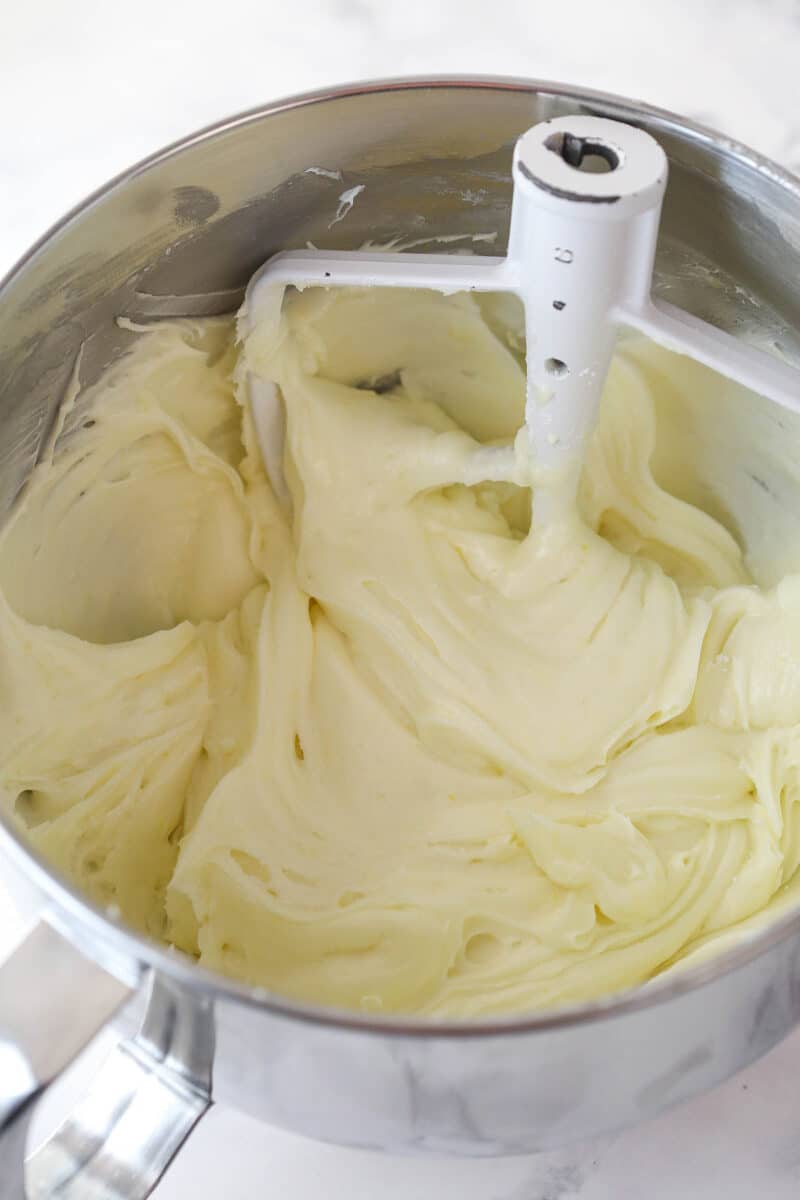 Lemon cream cheese frosting in a mixing bowl.