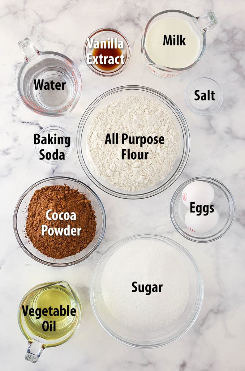 Chocolate cake ingredients separated into bowls.