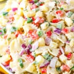 Pineapple Salsa Pasta Salad in a white bowl on a white table