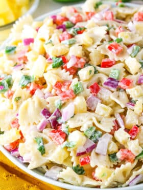 Pineapple Salsa Pasta Salad in a white bowl on a white table