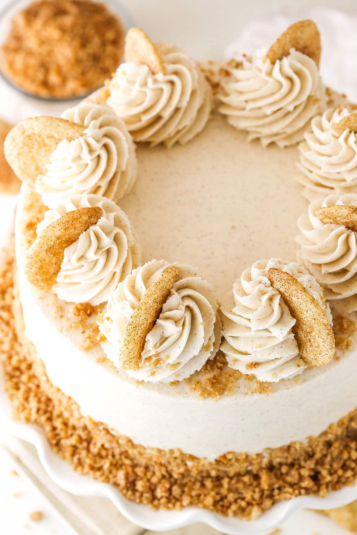 Overhead view of a Snickerdoodle Layer Cake on a white cake stand