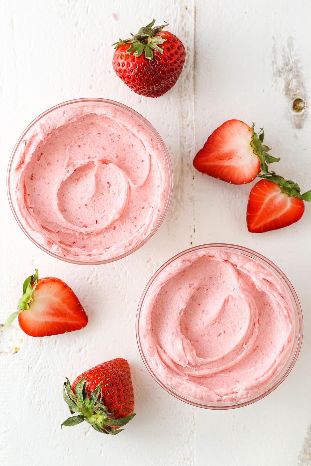 Two clear glass bowls of Homemade Strawberry Frosting