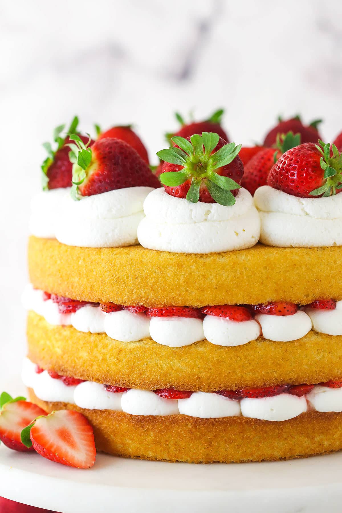 Side view of strawberry shortcake cake.