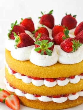 Strawberry shortcake cake on a serving platter.