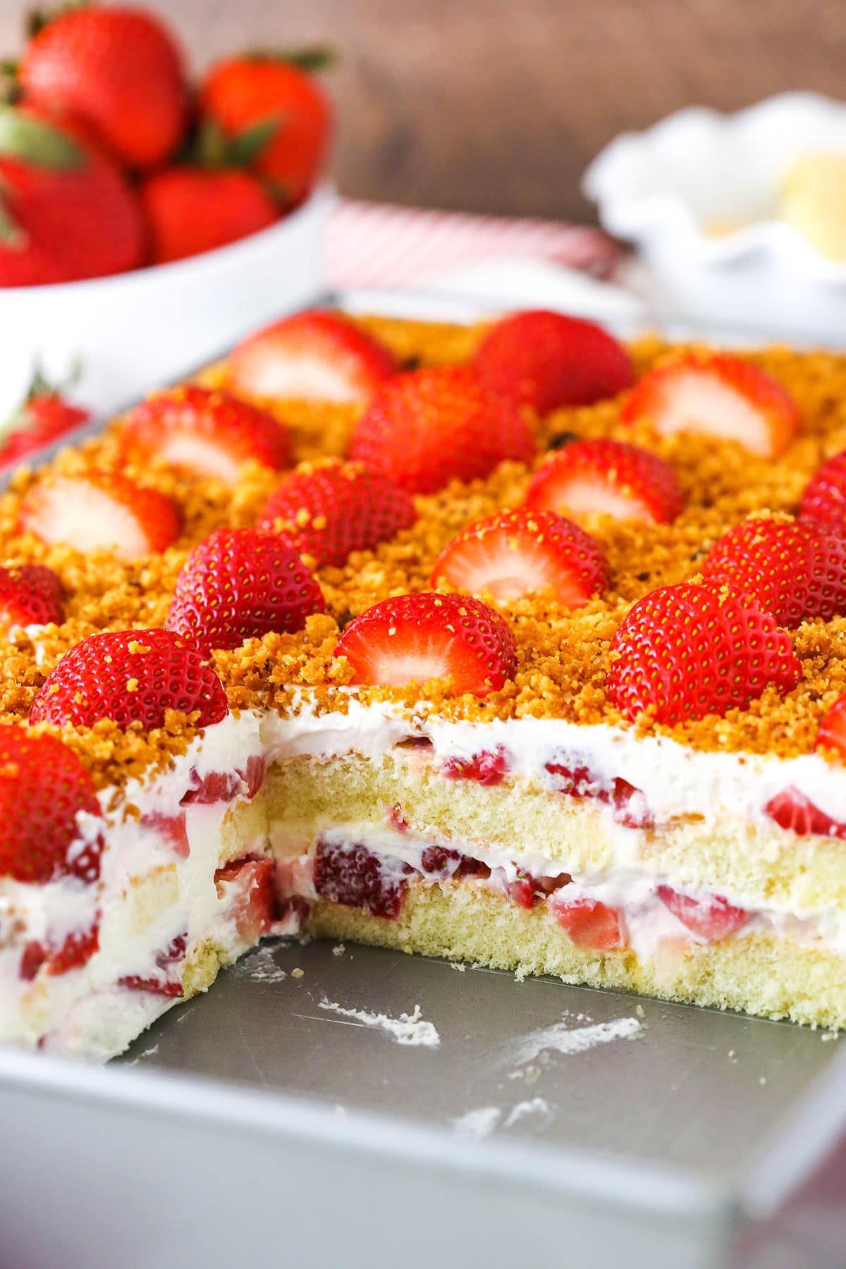 Strawberry Shortcake Icebox Cake with a serving removed showing the internal layers