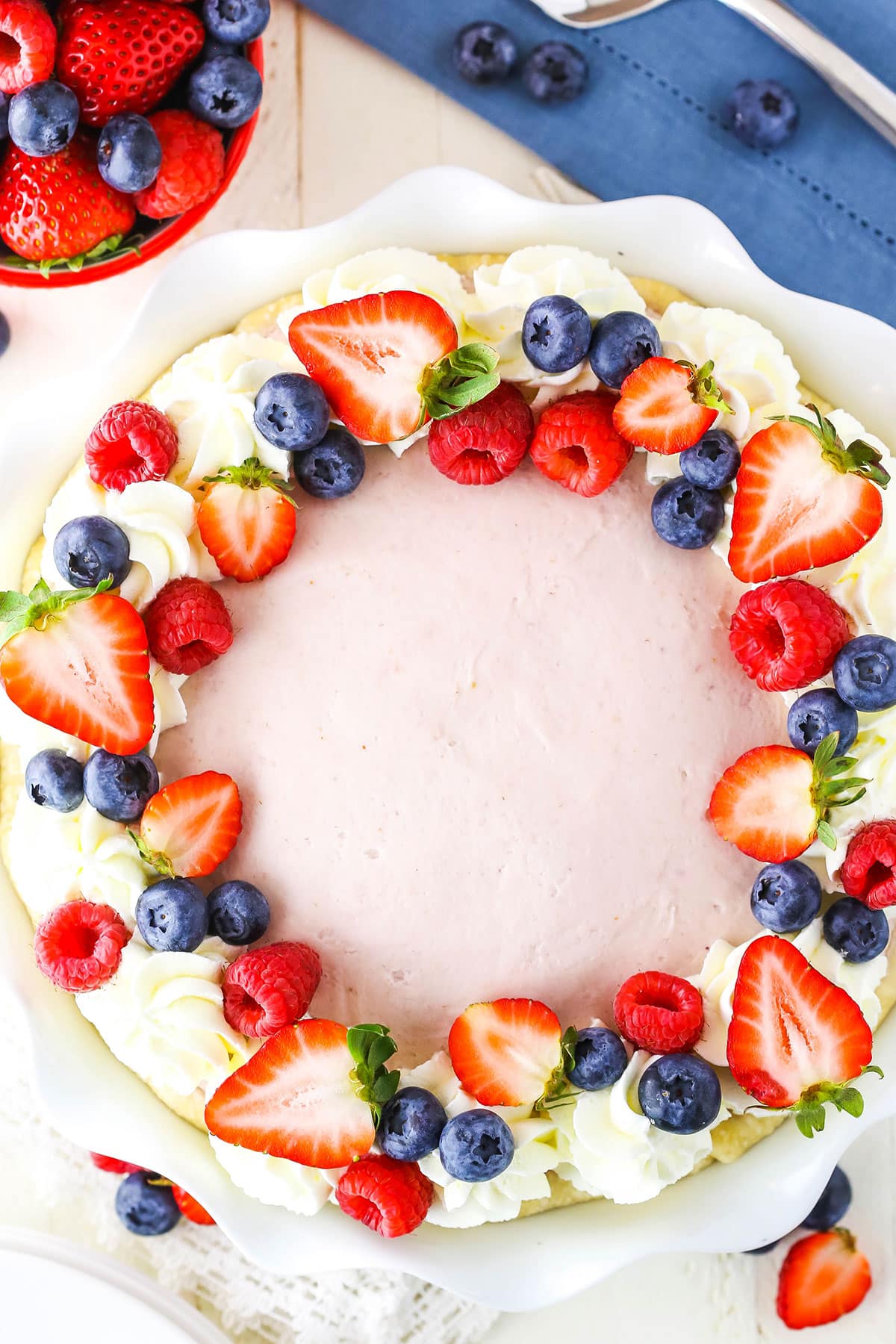 Overhead view of a full Berry Almond Cream Pie on a white platter