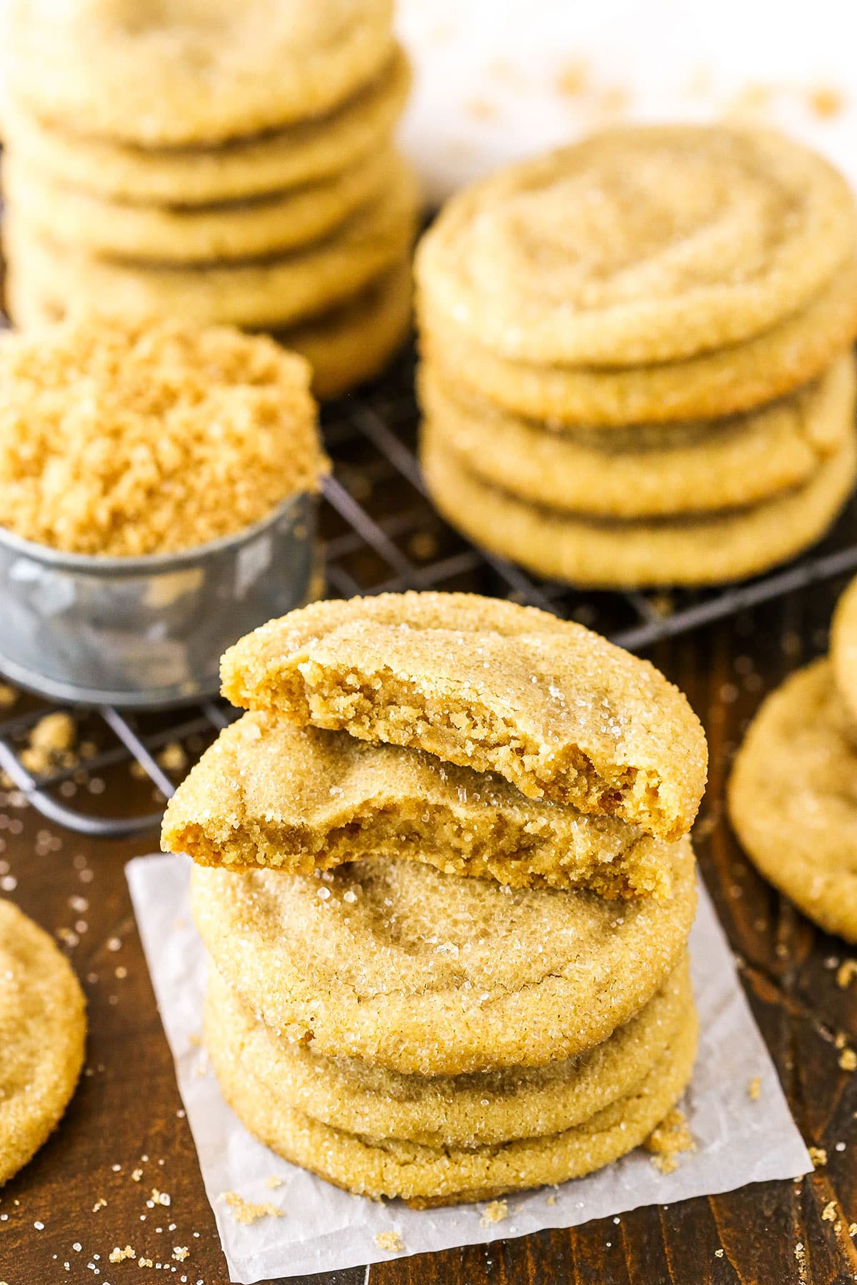Easy Chewy Brown Sugar Cookies stacked with the top cookie broken in half