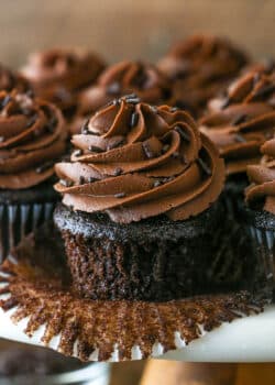 Pealing back the cupcake liner on a moist chocolate cupcake.