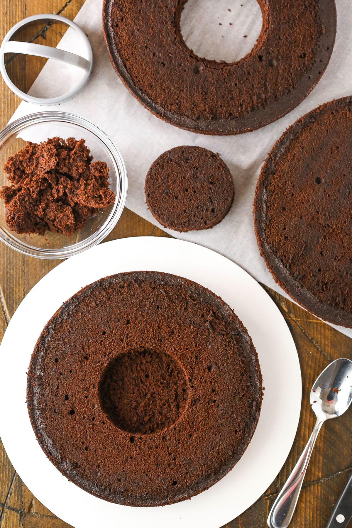 A step in making Chocolate Piñata Cake making a hole in the bottom layer without cutting all the way through