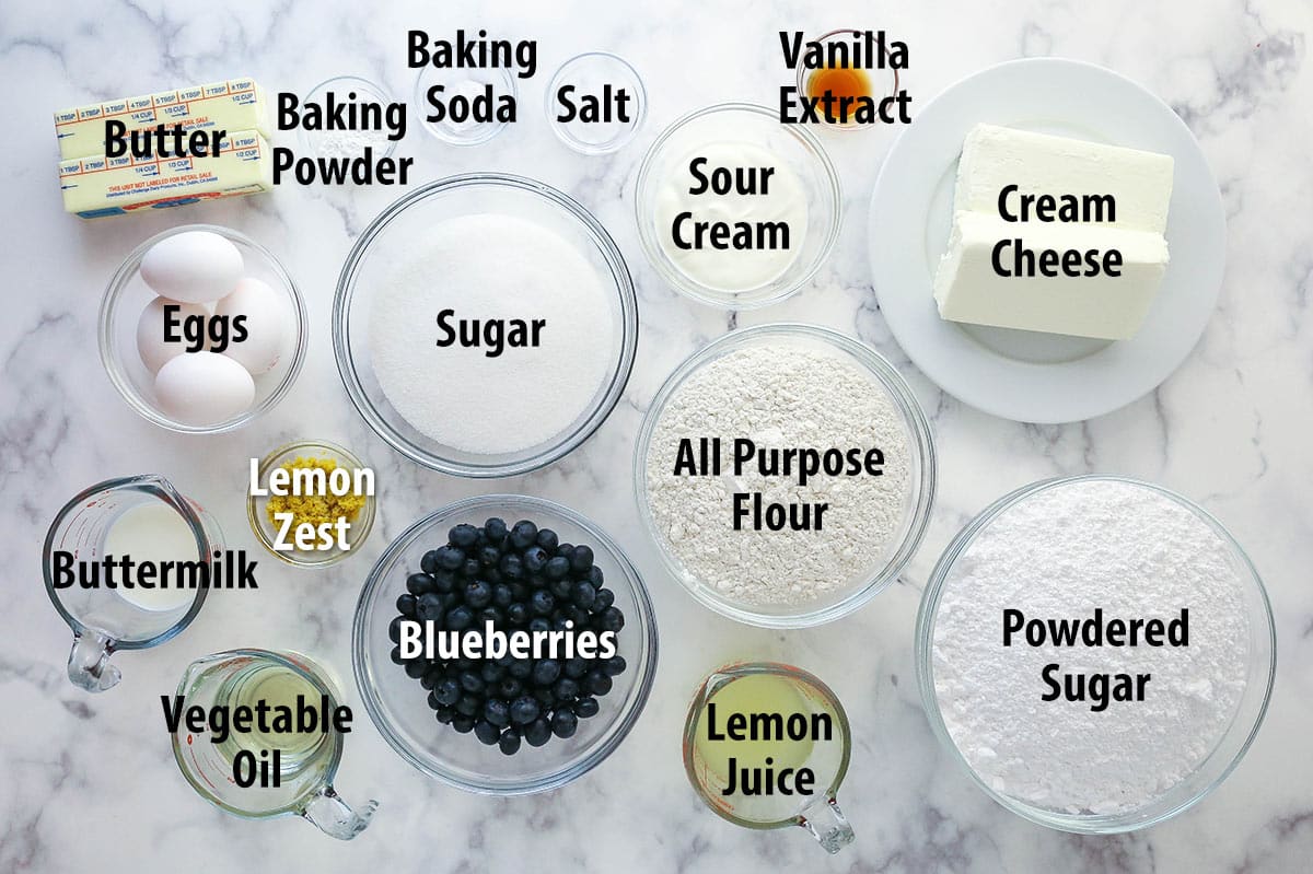 Ingredients for lemon blueberry layer cake separated into bowls.