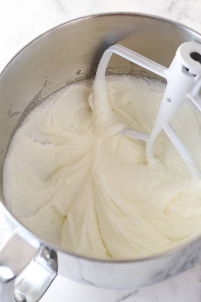 Creaming together butter, oil, and sugar for cake batter.