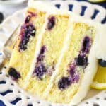 A slice of lemon blueberry cake on a plate.