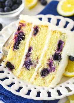 A slice of lemon blueberry cake on a plate.