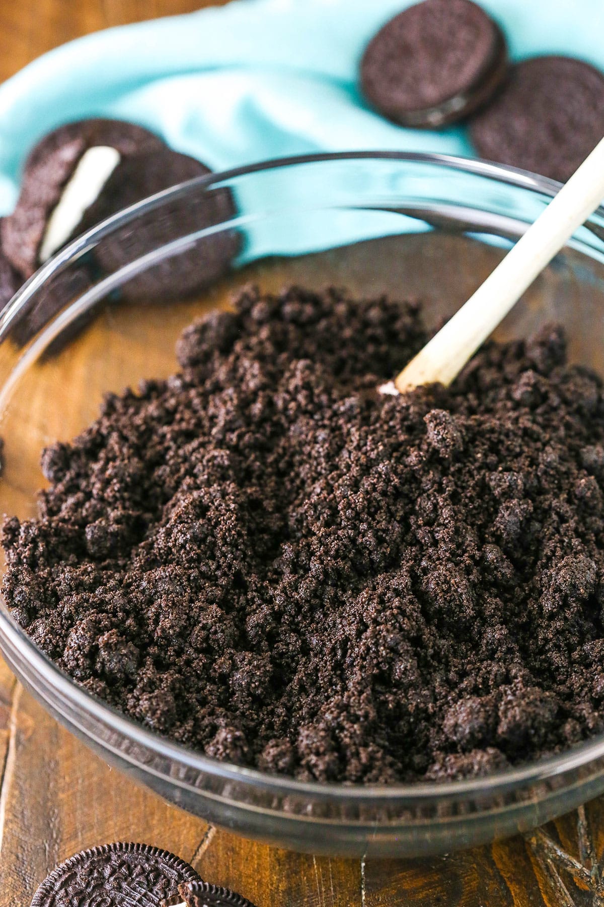 A glass bowl filled with Oreo Cookies turned into fine crumbs using a food processor