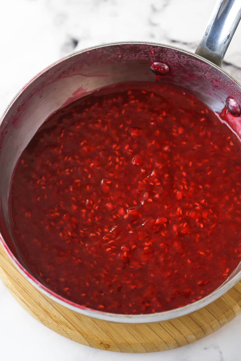 Crushed raspberries, melted sugar, cornstarch, and water reduced to form a thickened raspberry cake filling.