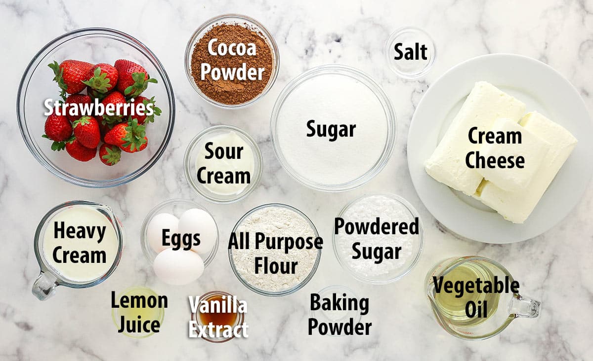 Ingredients for strawberry brownie cheesecake separated into bowls.