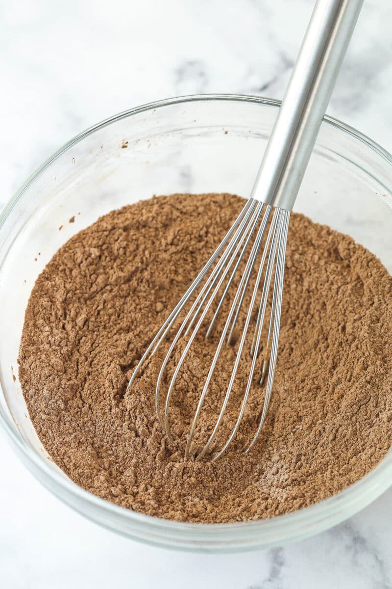 Whisking together dry ingredients for brownies.