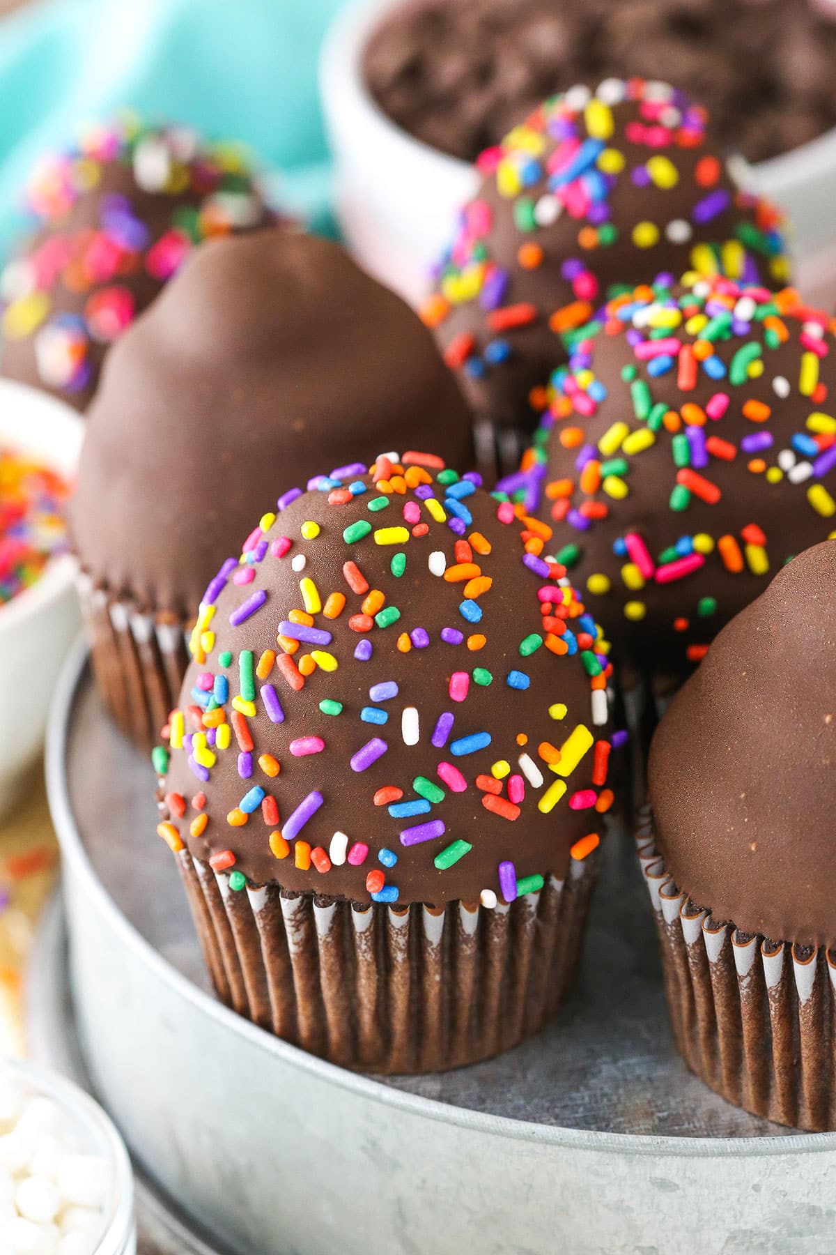 Ultimate Ice Cream Chocolate Cupcakes with and without multicolored sprinkles in a gray pan