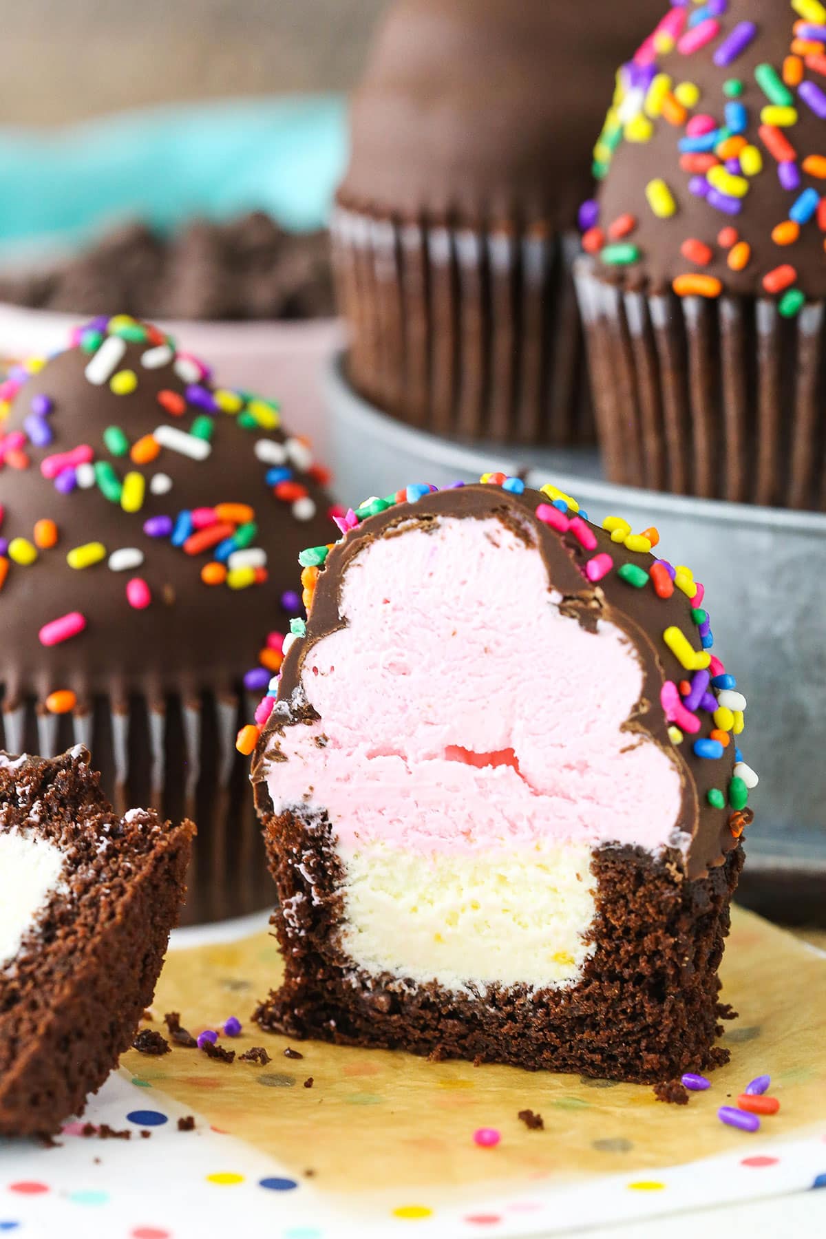 An Ultimate Ice Cream Chocolate Cupcake cut in half showing the inner textures