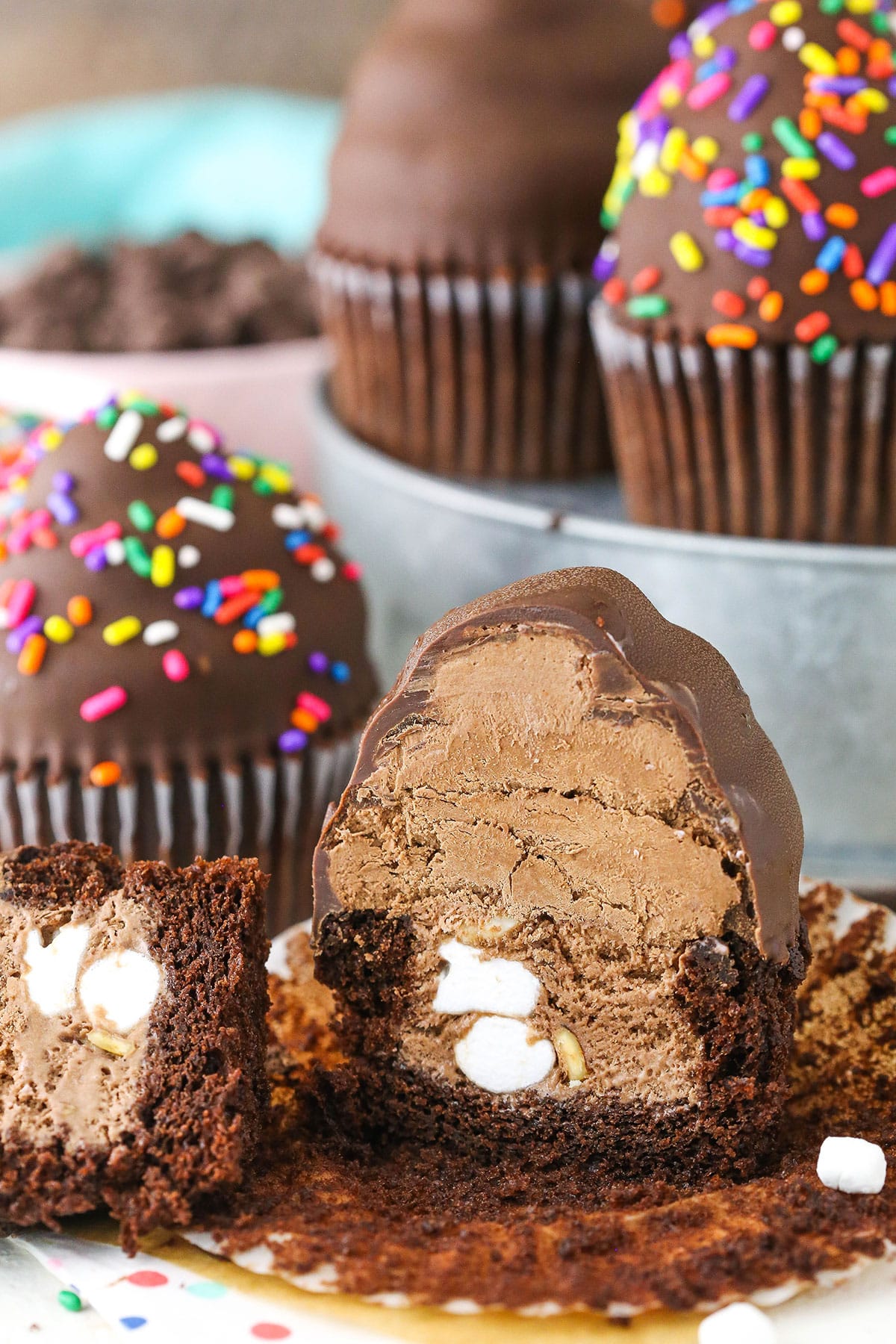 An Ultimate Ice Cream Chocolate Cupcake cut in half showing the inner textures