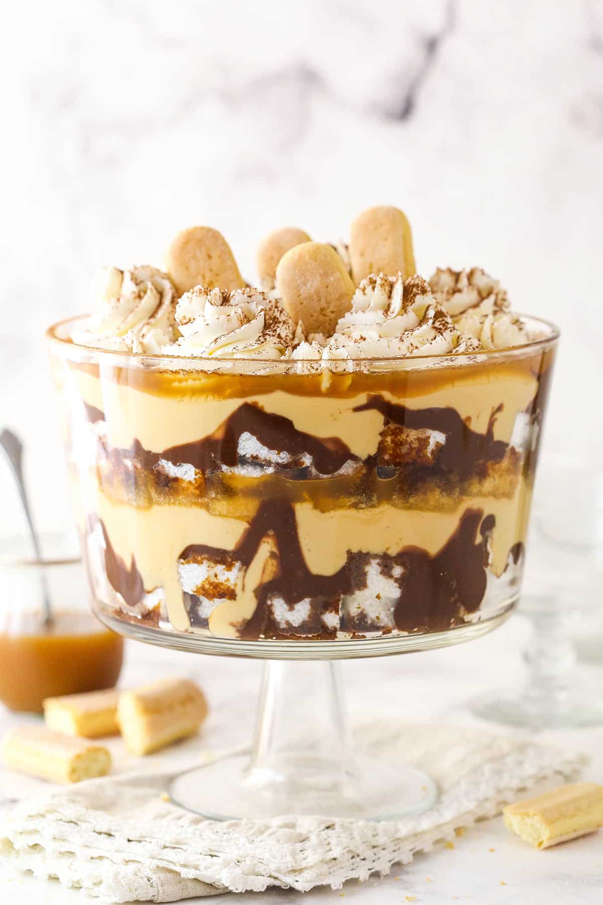 Tiramisu trifle elegantly displayed in a trifle dish.