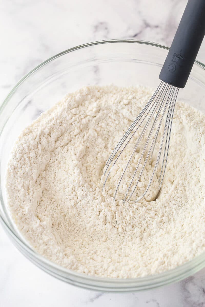 Whisking together dry ingredients for cookie dough.