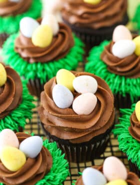 Easter Egg Chocolate Cupcakes on a gray wire cupcake stand