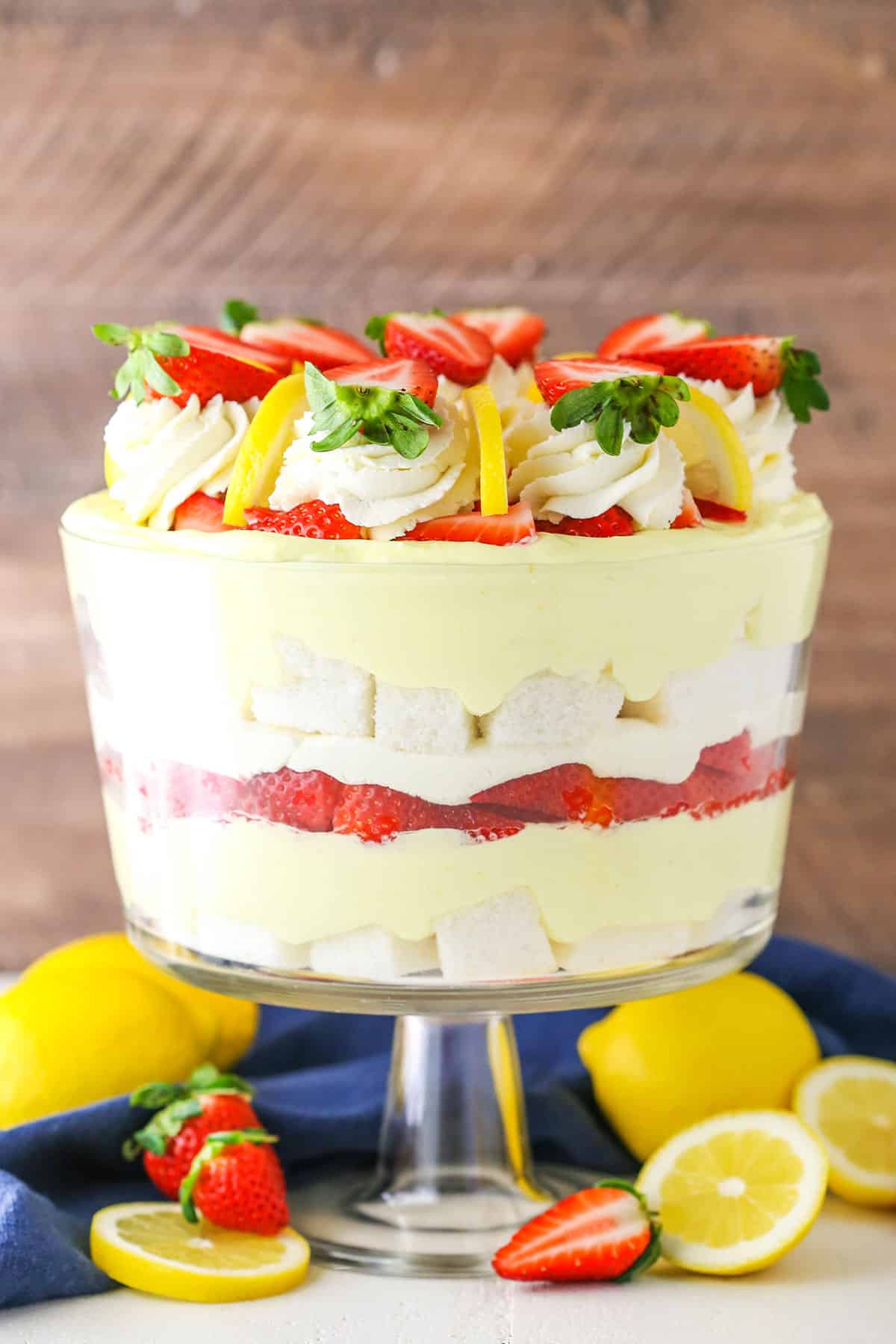 Side view of a full Lemon Strawberry Trifle in a clear glass trifle bowl