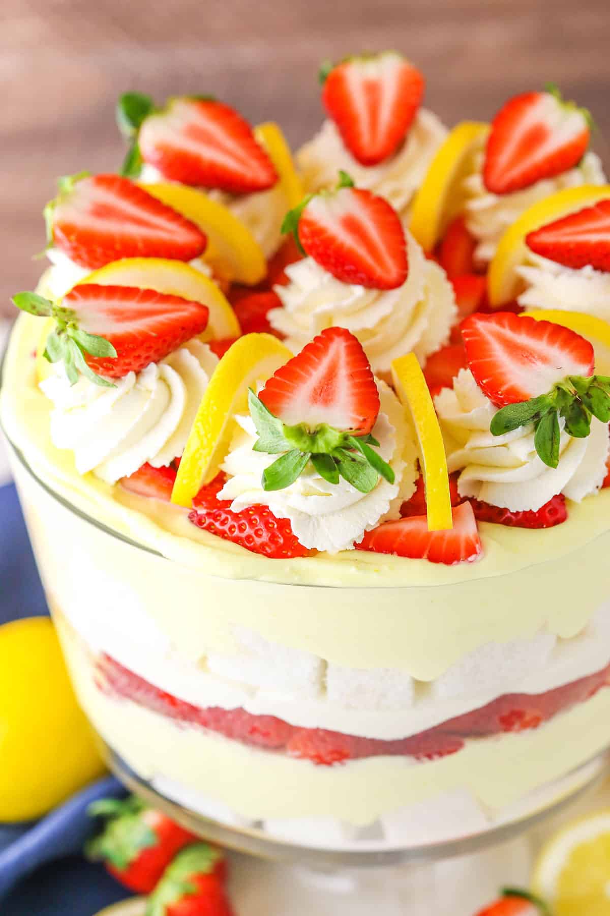 A Lemon Strawberry Trifle in a clear glass trifle bowl