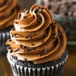 Fudgy Chocolate Buttercream Frosting piped onto a chocolate cupcake