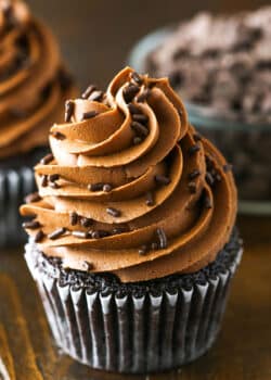 Fudgy Chocolate Buttercream Frosting piped onto a chocolate cupcake