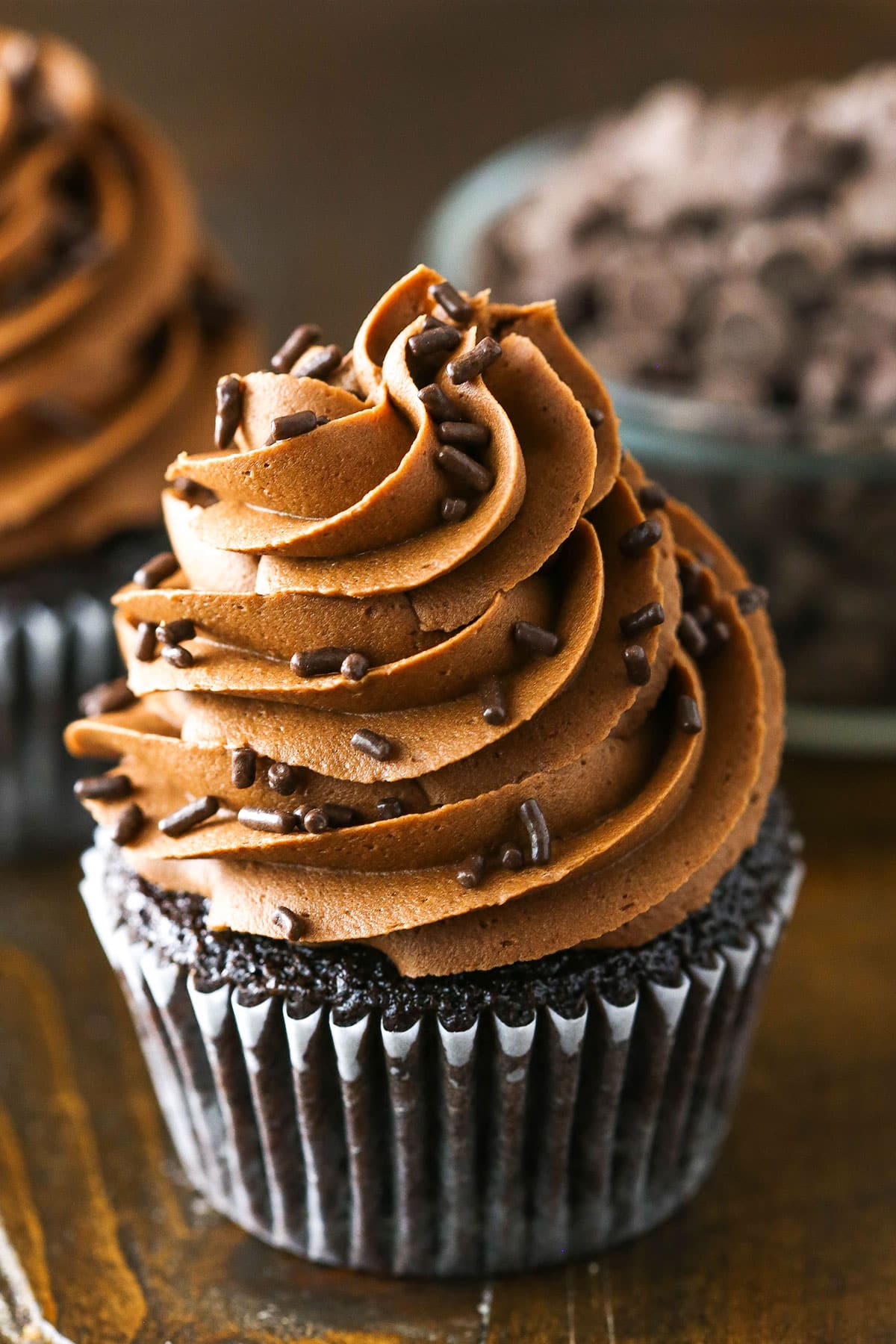 Fudgy Chocolate Buttercream Frosting piped onto a chocolate cupcake
