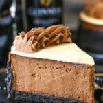 A slice of Guinness Chocolate Cheesecake on a black plate