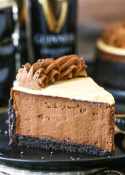 A slice of Guinness Chocolate Cheesecake on a black plate