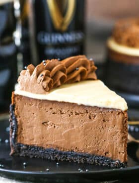 A slice of Guinness Chocolate Cheesecake on a black plate