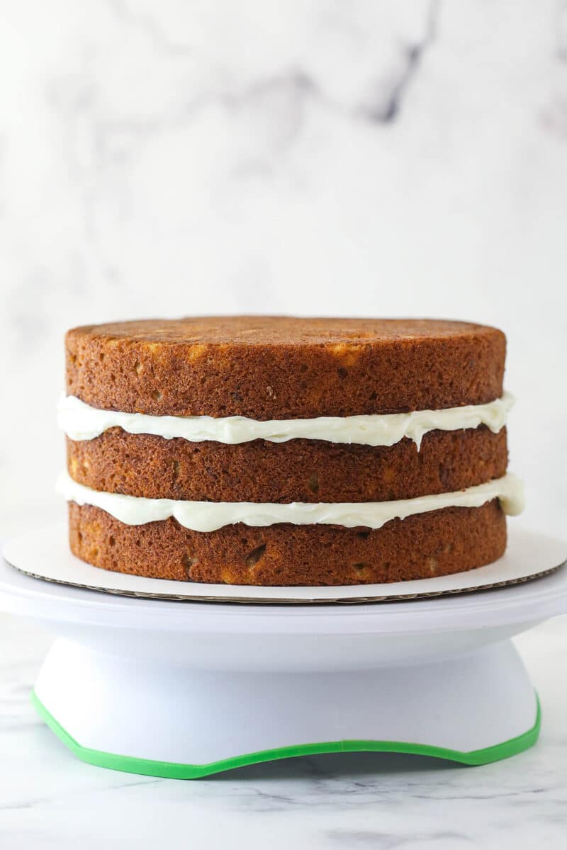 3 layers of cake divided by layers of cream cheese frosting.