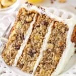 A slice of hummingbird cake on a plate with a fork.