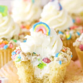A Lucky Charms Cupcake with a bite removed