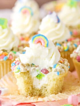 A Lucky Charms Cupcake with a bite removed
