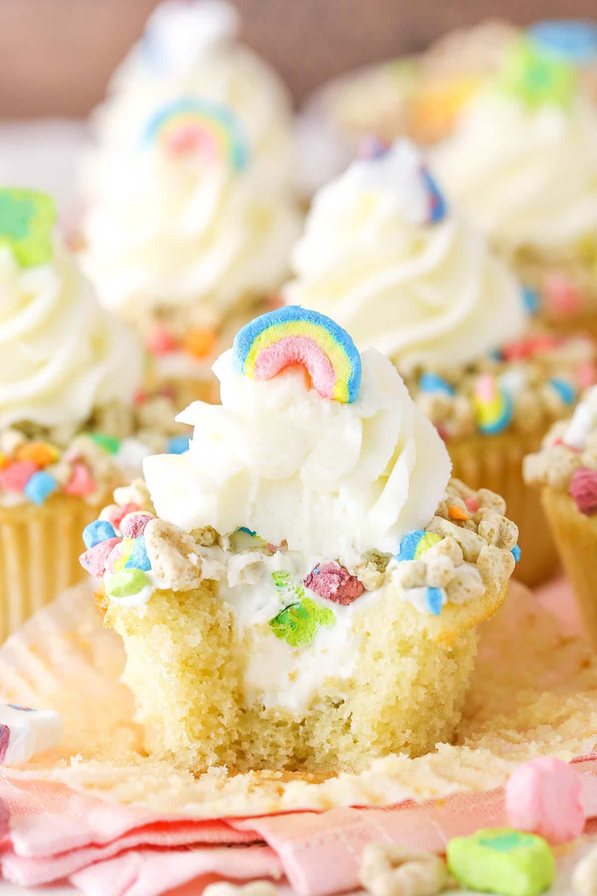 A Lucky Charms Cupcake with a bite removed